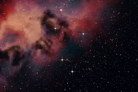 Artistic rendering of a red emission nebula with dark dust clouds and scattered stars